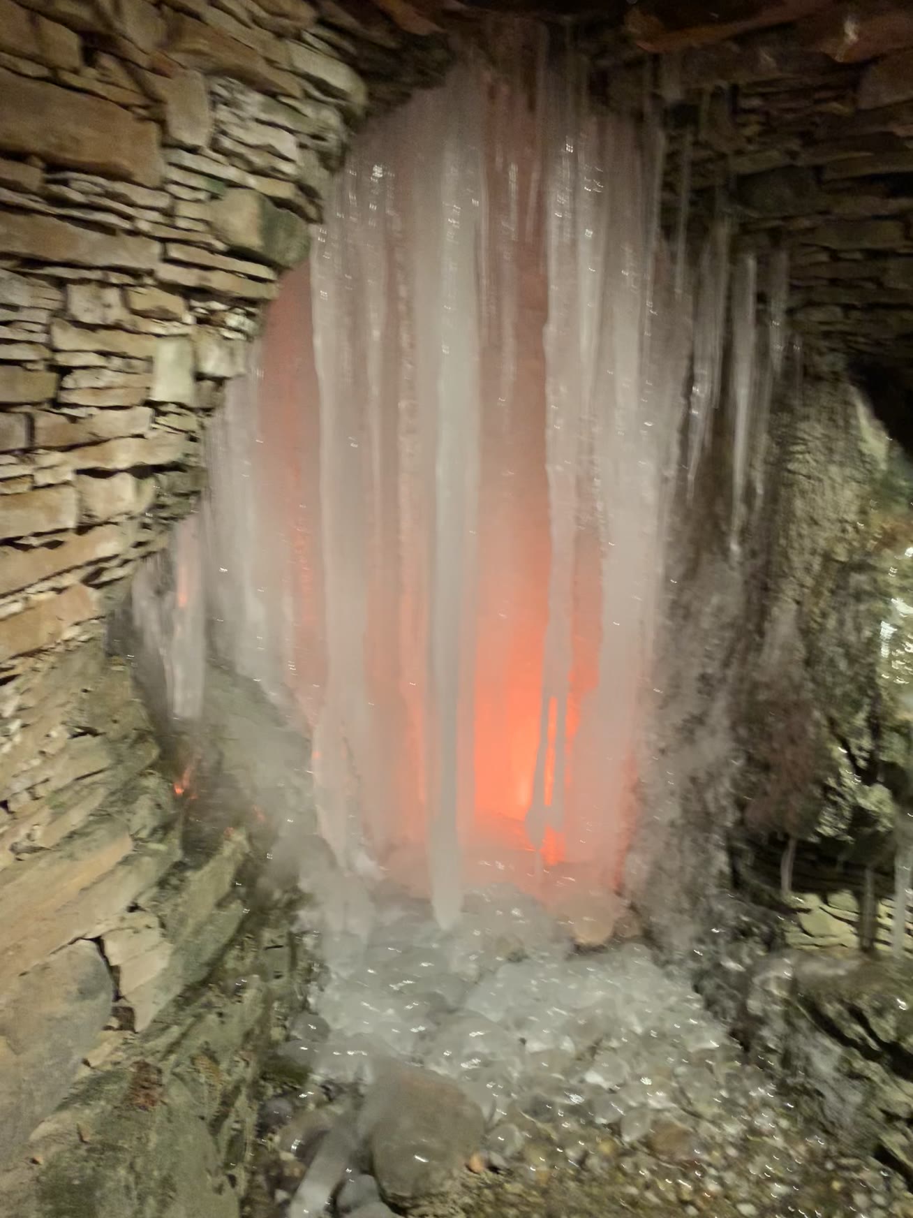 Illuminated grotto waterfall